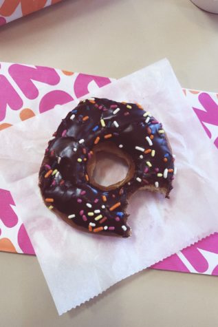 Chocolate frosted donut with rainbow sprinkles from Dunkin