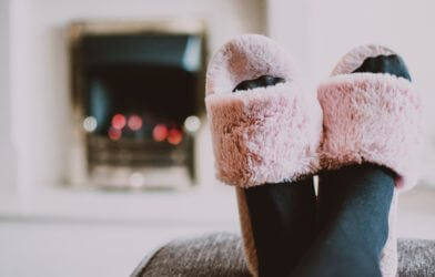 Woman wearing pink fuzzy slippers