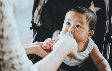 Baby drinking formula or milk from a bottle