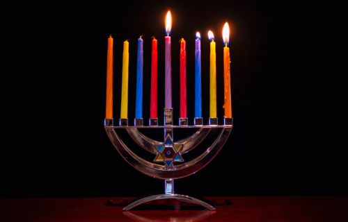 Hanukkah menorah with colorful candles.