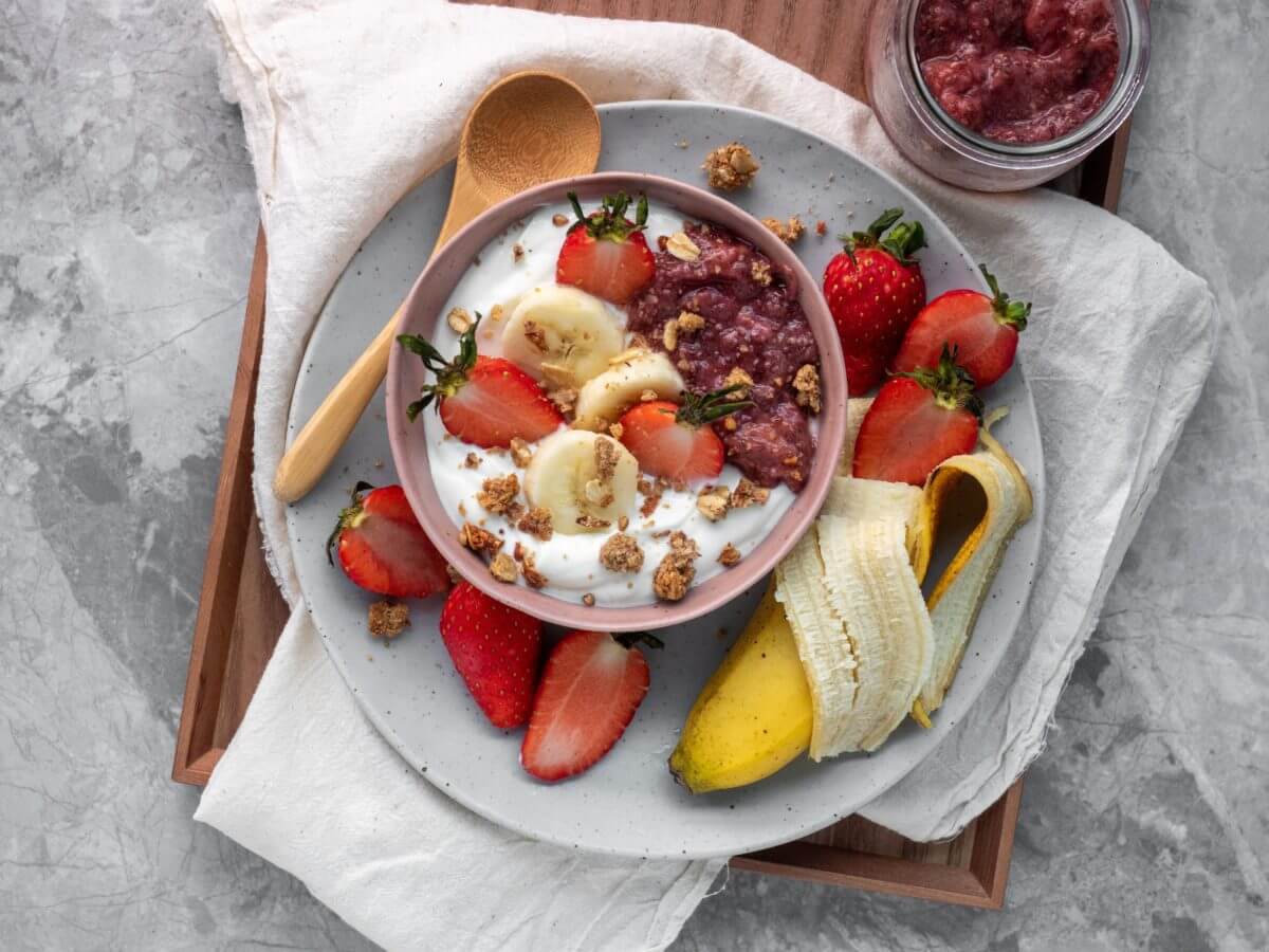 Bowl of yogurt with fruit and oats