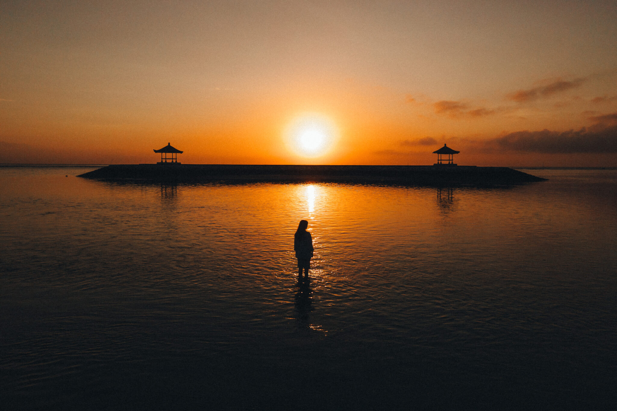 Sunset in Bali. (Photo by Mikhail Nilov on Pexels)