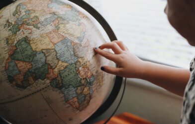 Child looking at a globe