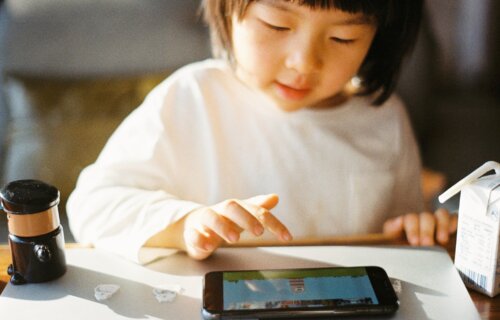 Little girl using a tablet for kids