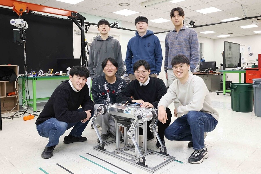 7 scientists standing with a robotic dog