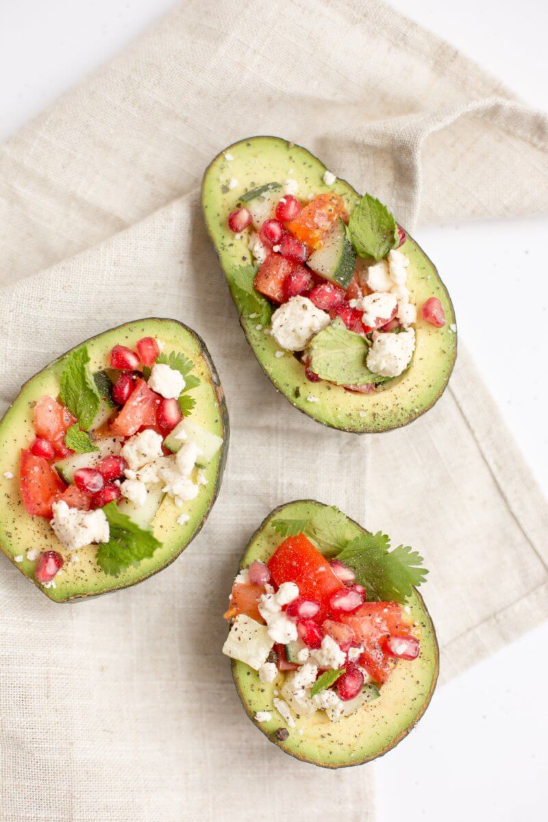 Avocados make for one of the best high-fiber snacks -- and stuffing them with your favorite salad ingredients make them especially enjoyable. 