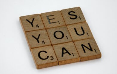 Scrabble tiles reading "Yes You Can"