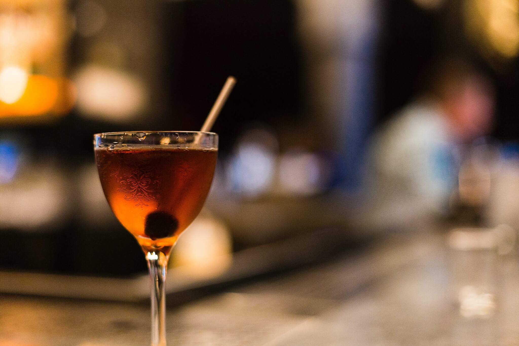 a bijou cocktail at a bar