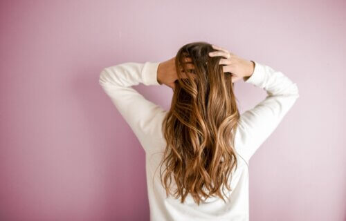 A women feeling her hair
