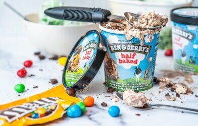 Ben and Jerry's ice cream with a scooper and m&m's