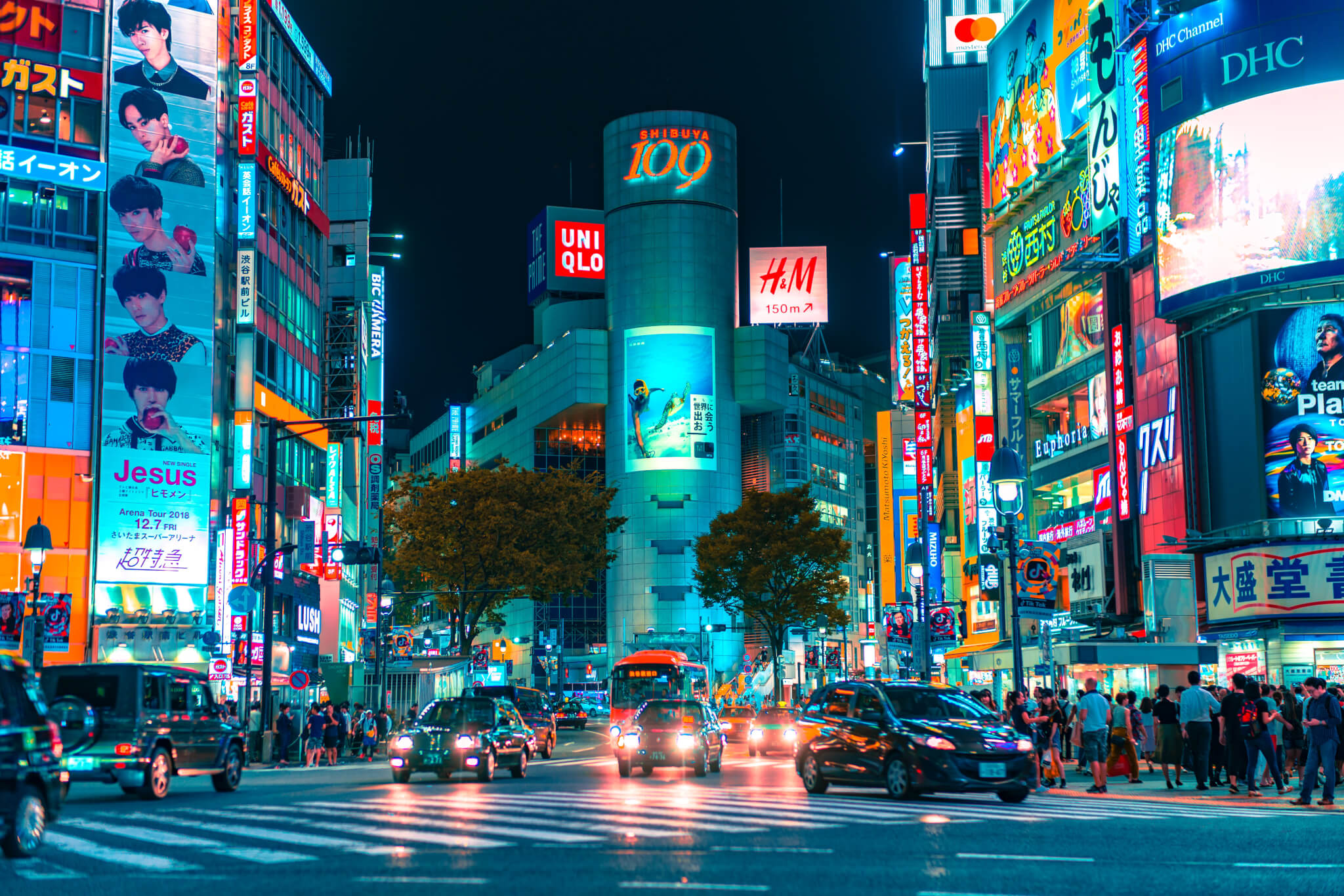 Busy downtown Shibuya, Japan with billboards and lights