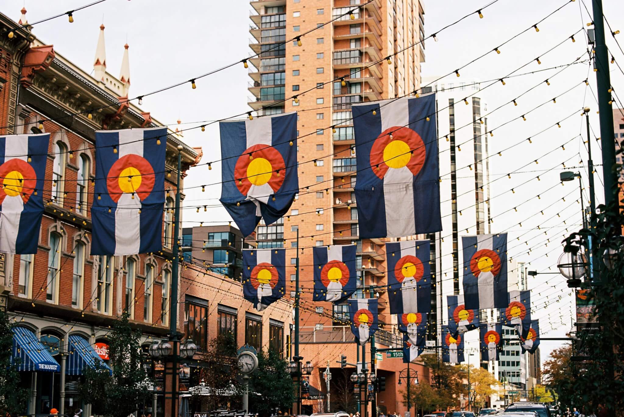 a street in Denver with Colorado flags