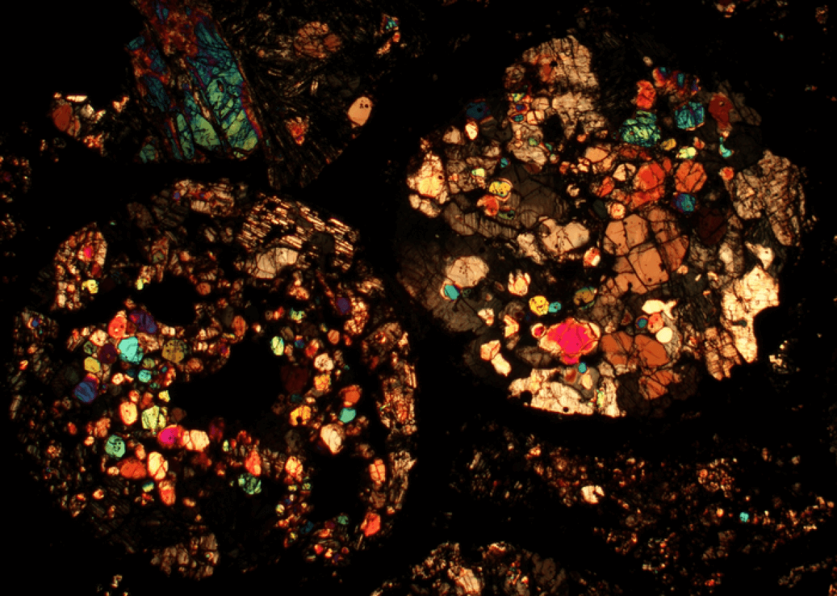 Microscopic view of a meteorite's colorful interior
