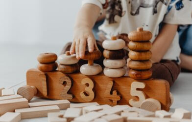 A child playing with number blocks