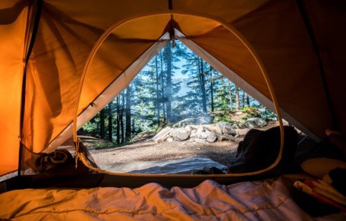Camping in a tent in the wilderness