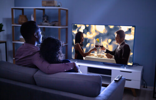 Couple watching a romantic movie on TV