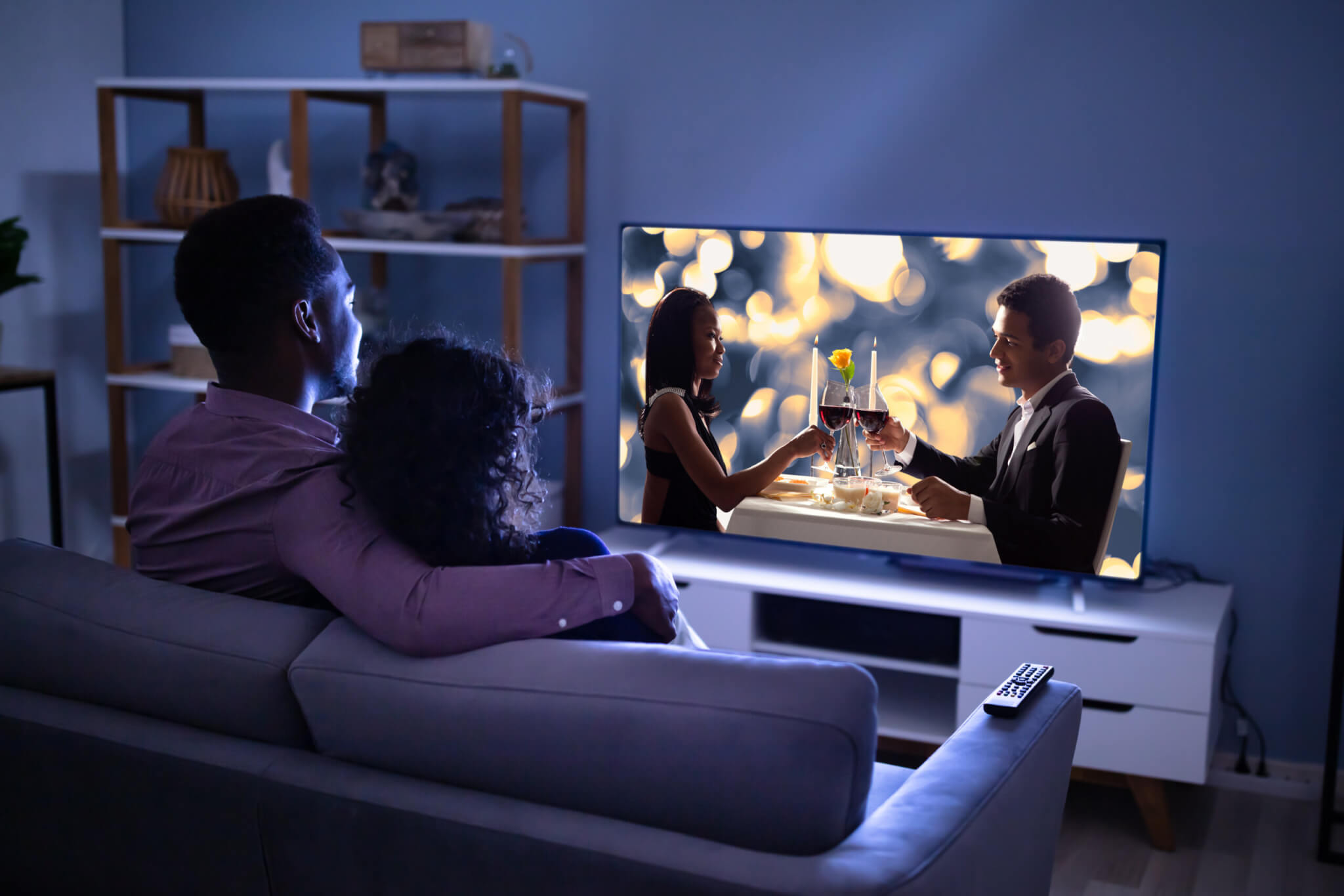 Couple watching a romantic movie on TV