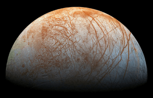 pic of Jupiter's moon, Europa, with red streaks across its surface.