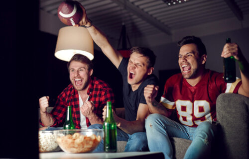 Friends watching the Super Bowl or football game on TV