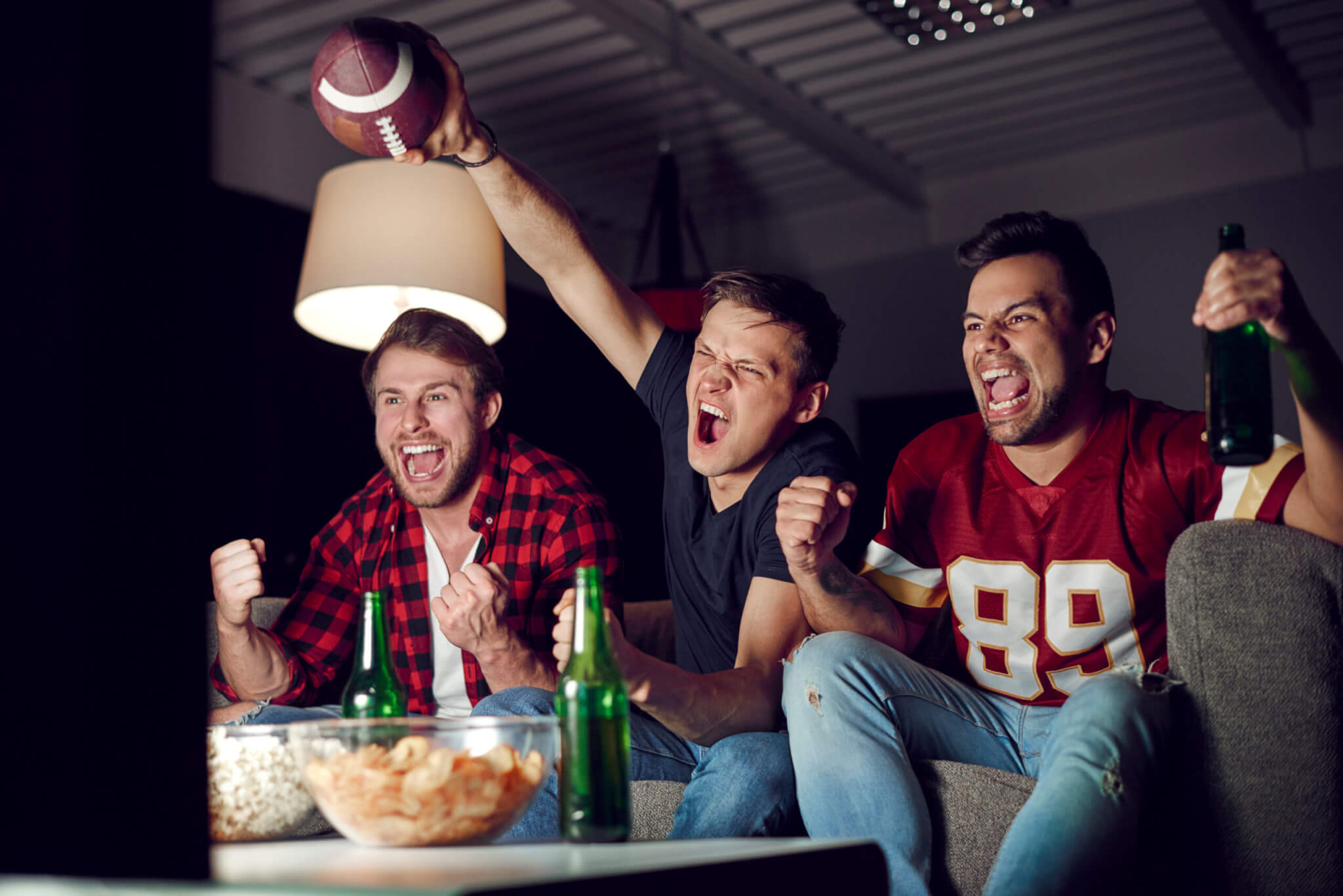 Friends watching the Super Bowl or football game on TV