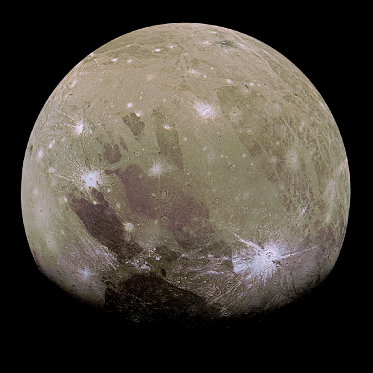 PIc of Ganymede, Jupiter's largest moon. It's beiged with splashes of white streaks across the surface.