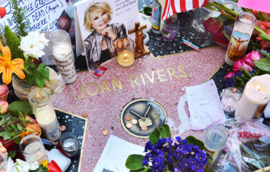 Joan Rivers' star on the Hollywood Walk of Fame is surrounded by flowers and various memorial tributes left by fans on September 6, 2014.