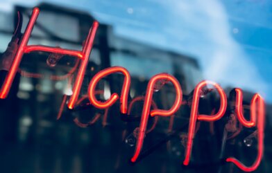 Neon lights that say "Happy"