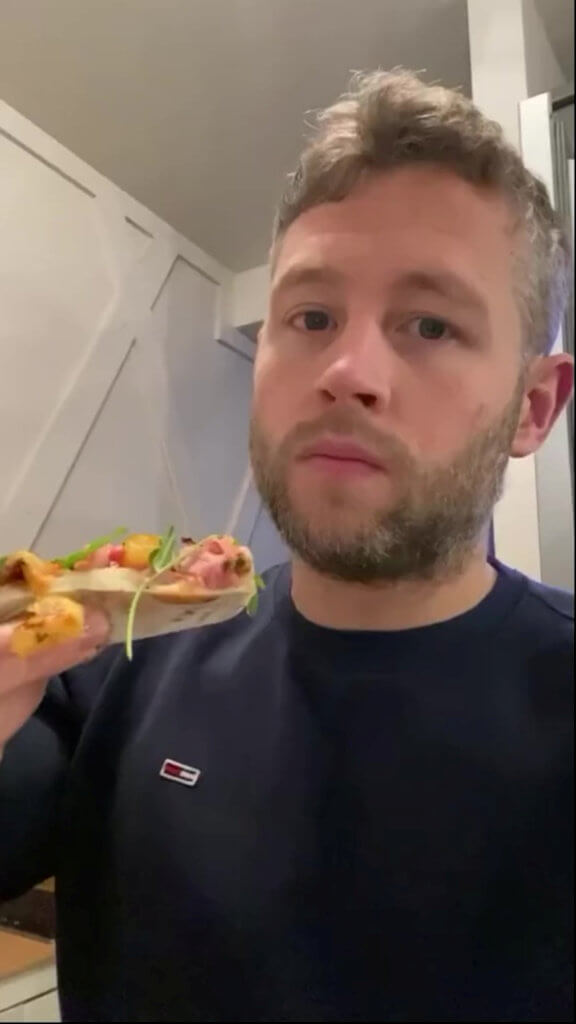 Personal trainer Ryan Mercer eating pizza