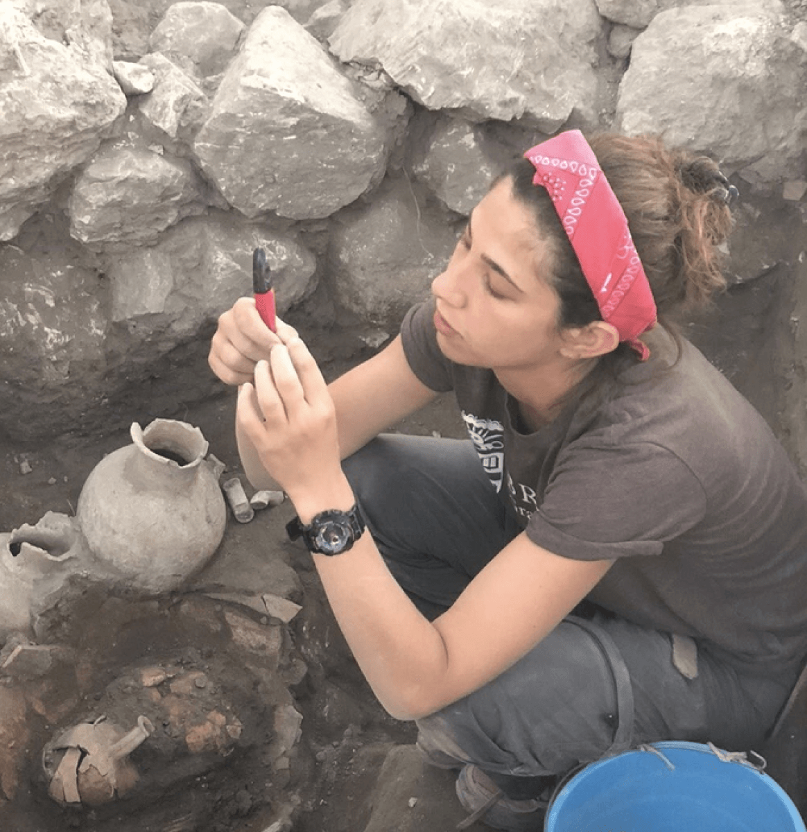 Female researcher working at a dig site