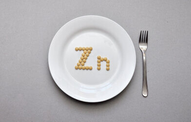Zinc supplement tablets on a plate