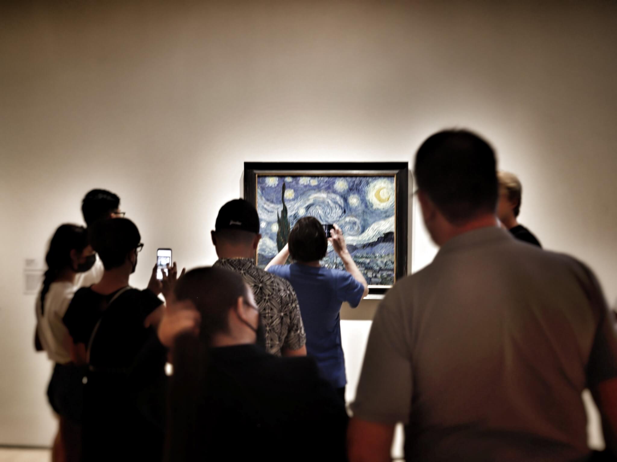 People looking at Starry Night at the Moma