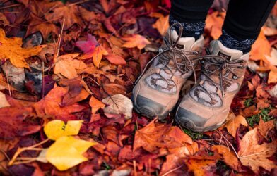 women's hiking boots and fall leaves