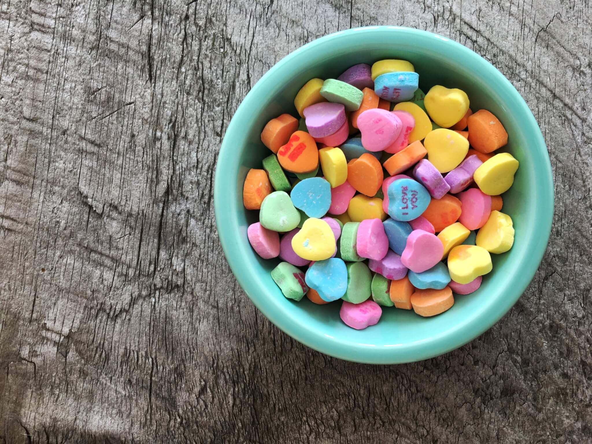 conversation hearts in a bowl