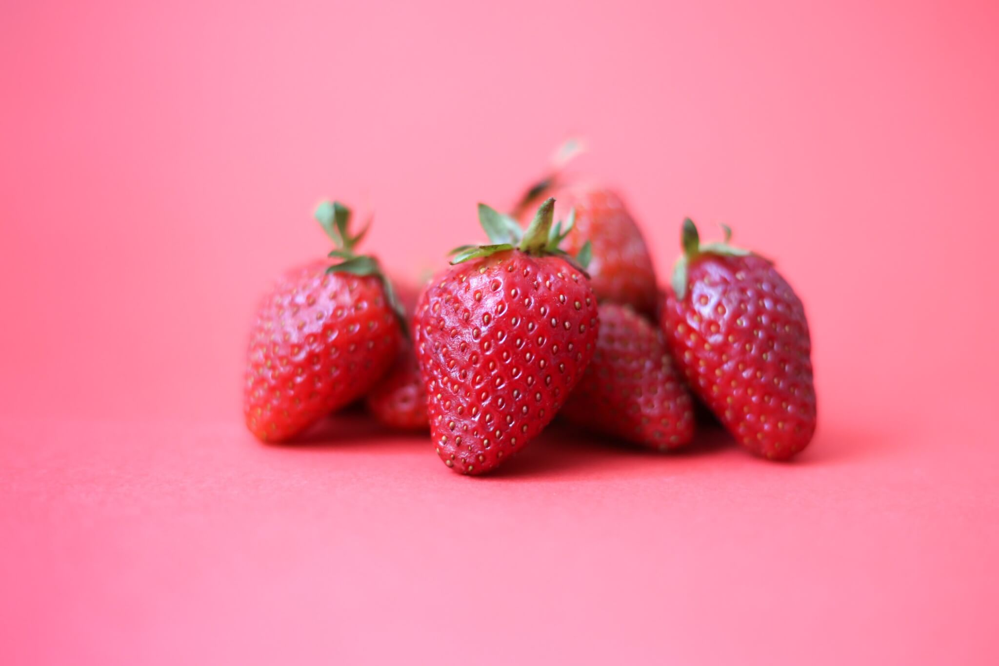 strawberries in a pink background