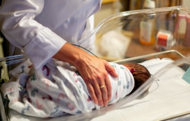 mother holding baby in hospital