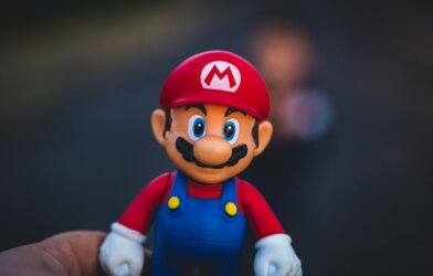 super mario in blue and red shirt figurine