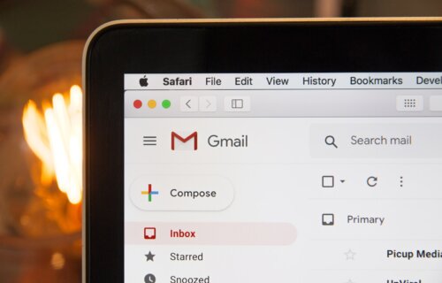 Gmail opened on a laptop in front of a fire