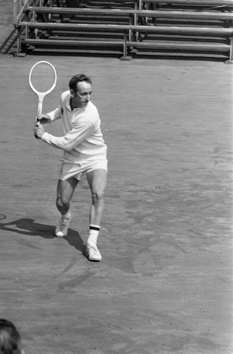image of Rod Laver returning with a backhand shot in tennis