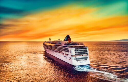 Cruise ship heading toward the sunset