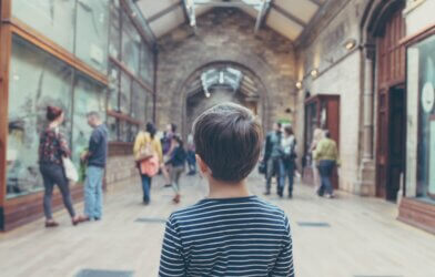 Child looking on at a museum