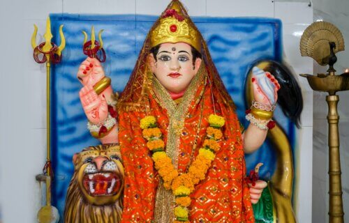 A beautiful idol of Maa Durga being worshipped at a Hindu temple