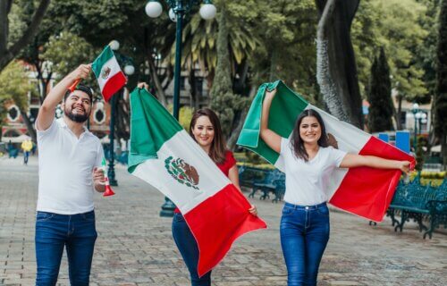 Mexican citizens holding Mexico flag