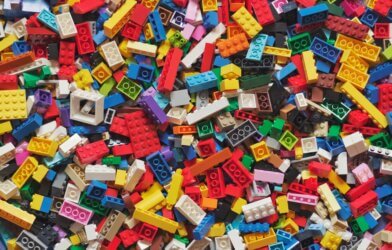 Legos of all shapes and sizes and colos in a pile