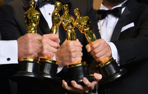 Group of Oscar Award winner holding trophies