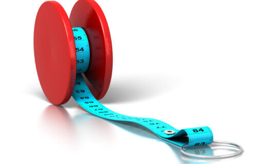 Yo-yo dieting concept: Tape measure on yo-yo