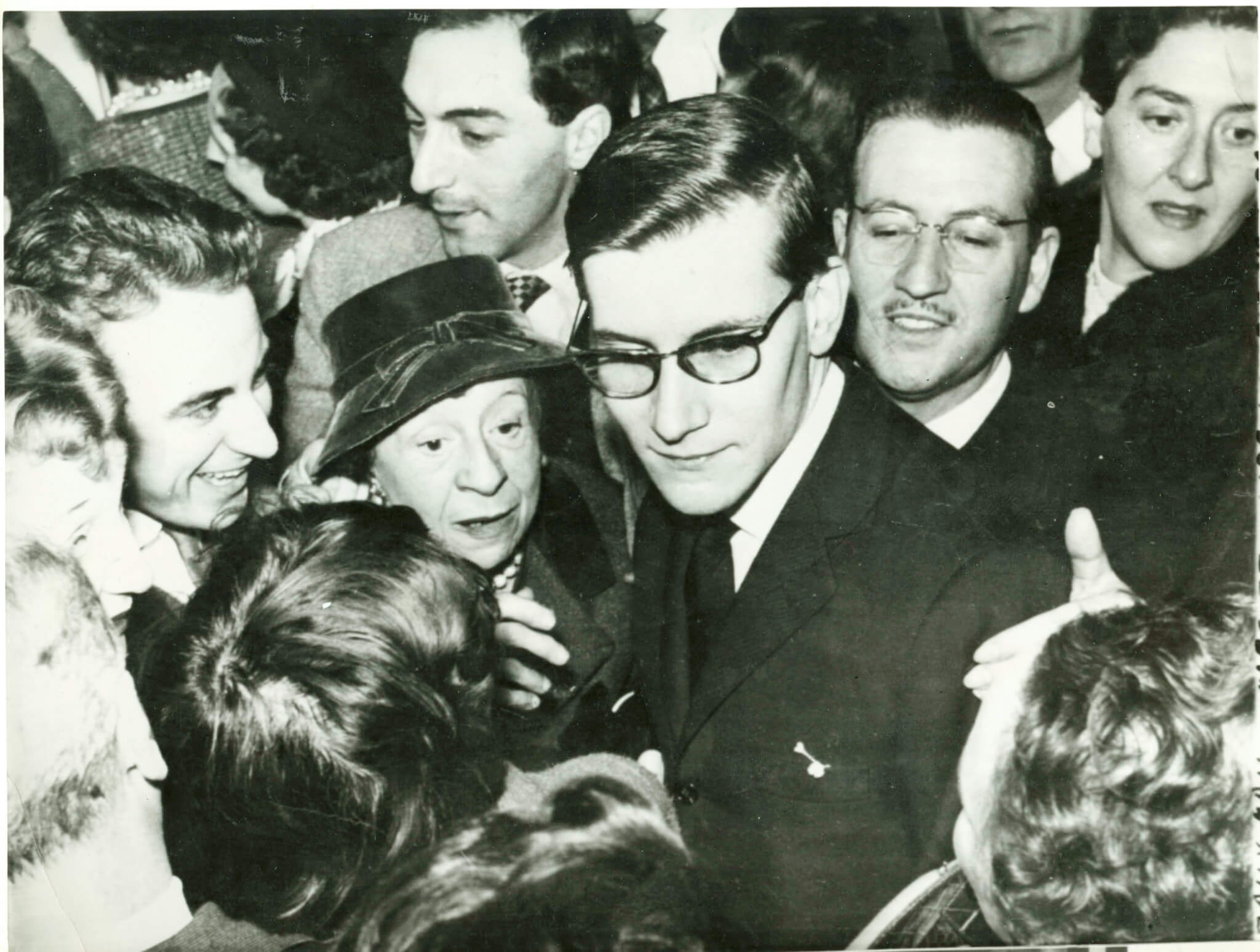 Yves Saint Laurent is greeted by a crowd after a big show in Paris.