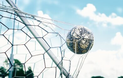 Soccer ball hitting a goal net