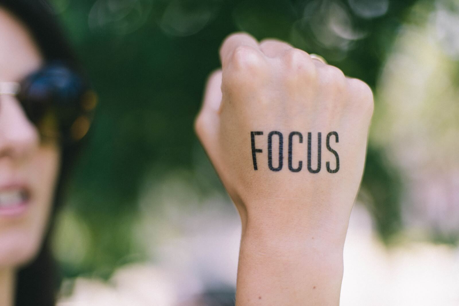 "Focus" written on a fist