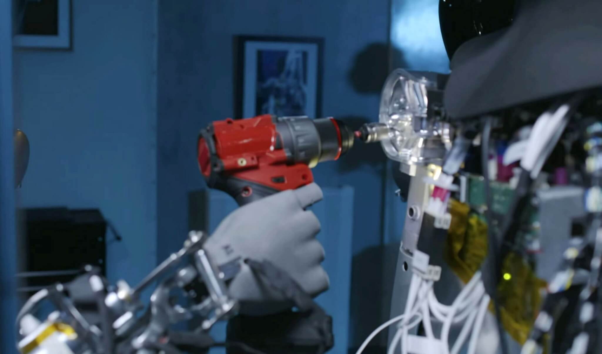 A Tesla robot using tools
