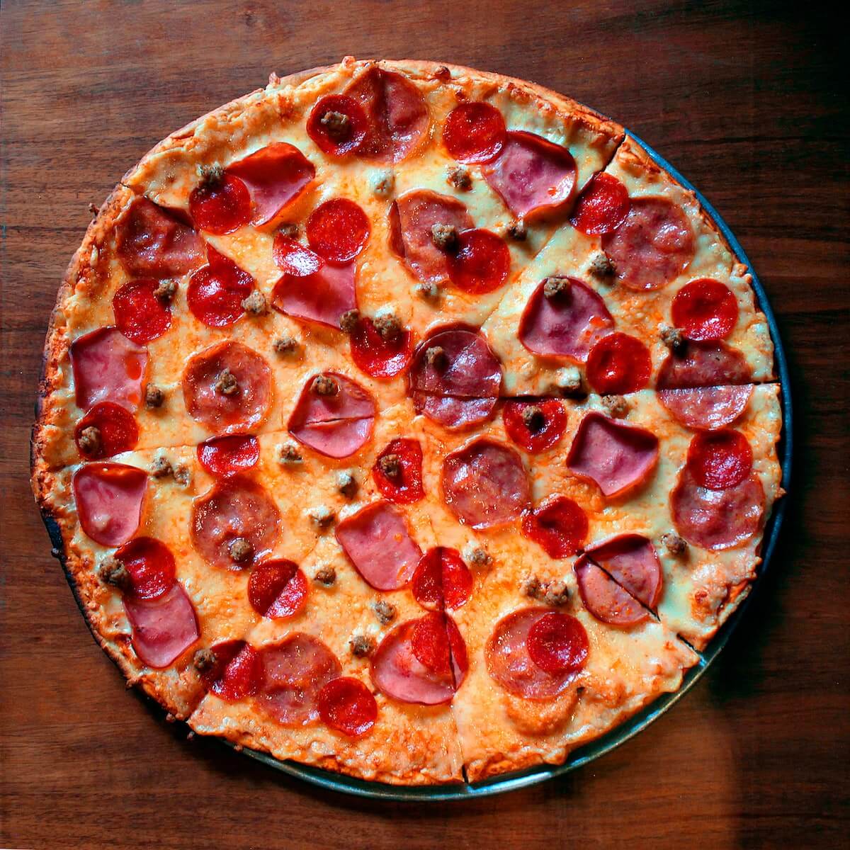 whole pepperoni pizza with cheese and tomato